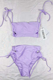 Haut de bikini bandeau long lilas à découpes croisées et lacets sur les côtés