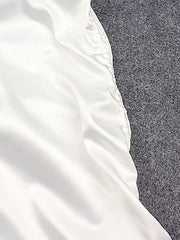 Mini-jupe froncée en satin irrégulière